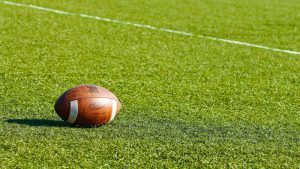 football laying on grass field