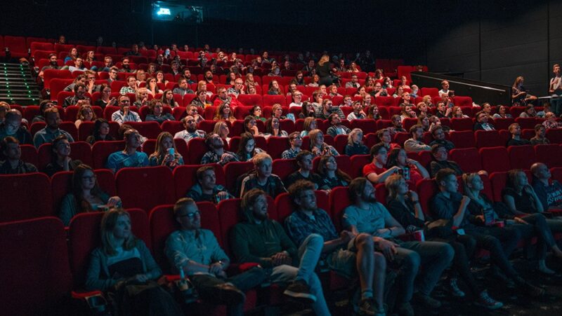 theater full of people watching a movie