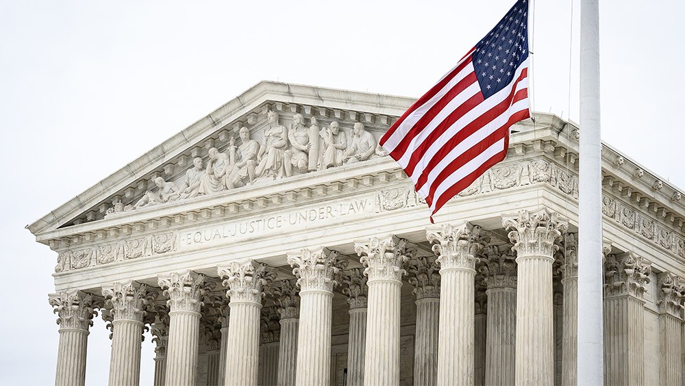 U.S. Supreme Court with flag flying out front