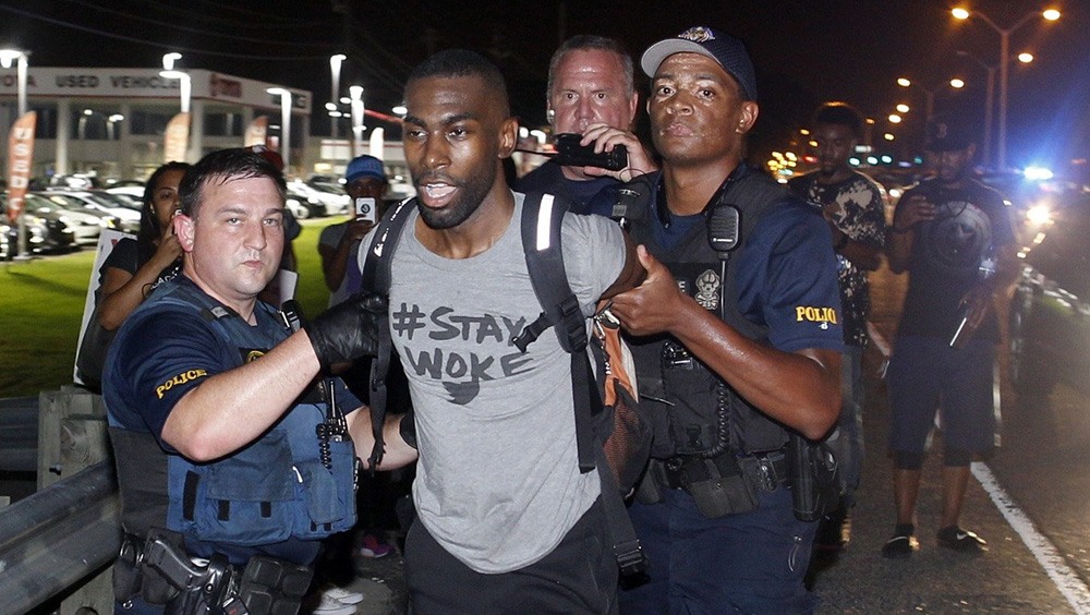 Police arrest activist DeRay McKesson during a 2016 protest in Baton Rouge, La.