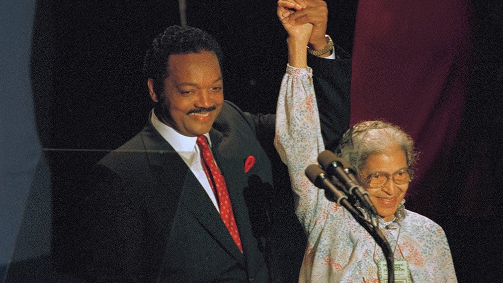 Jesse Jackson raises the arm of Rosa Parks at the 1988 Democratic National Convention.