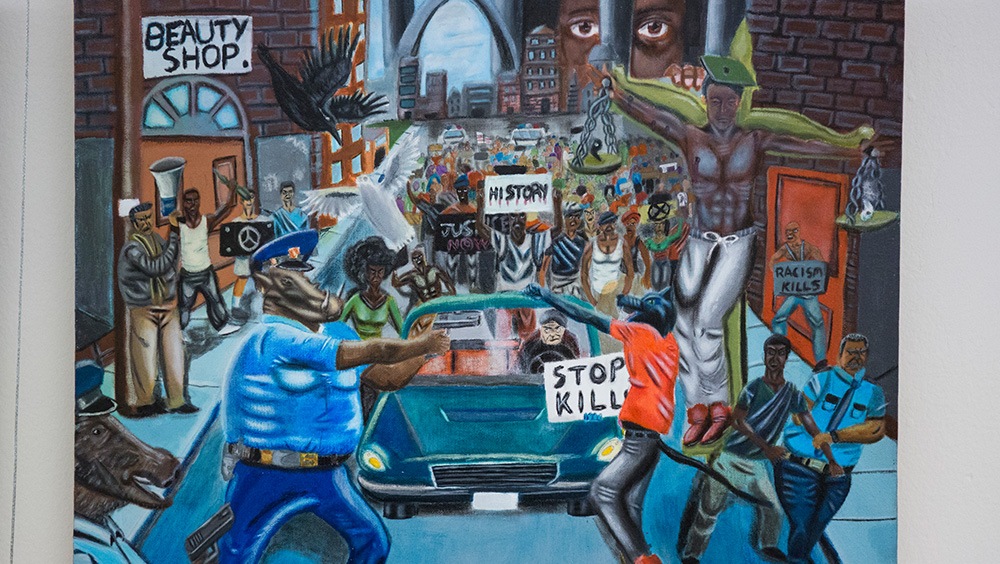 A painting depicting Ferguson, Missouri, with the image of a pig in a police uniform aiming a gun at a protester.