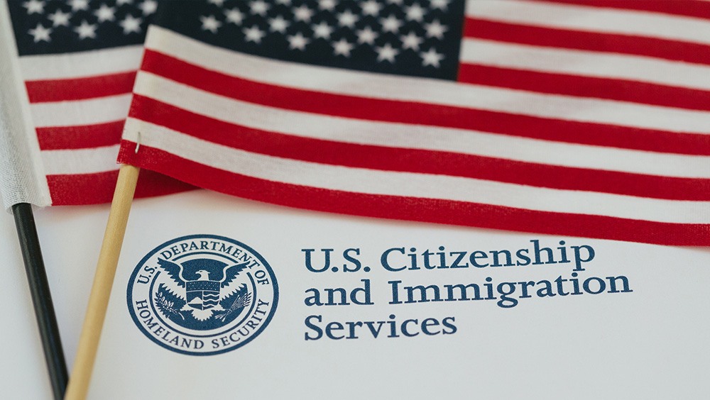 US flag and citizenship and immigration paperwork