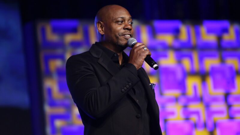 Comedian Dave Chappelle performs on stage