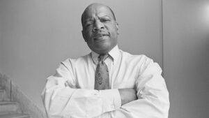 Representative John Lewis, D-Ga., stands with his arms crossed on August 13, 1991.