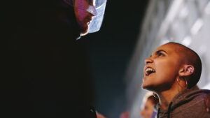 Angry protestor yelling in face of police