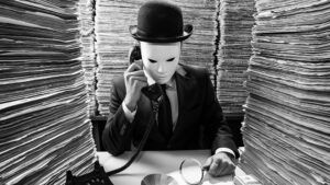 catch and kill journalism concept of masked man sitting in room full of newspapers on phone with stack of money