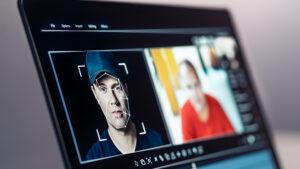 Image of two faces side by side with deepfake facial tracking technology being applied