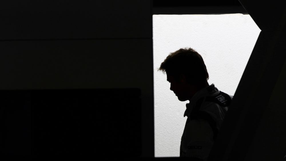 A silhouetted image of Brad Pitt against a bright white background