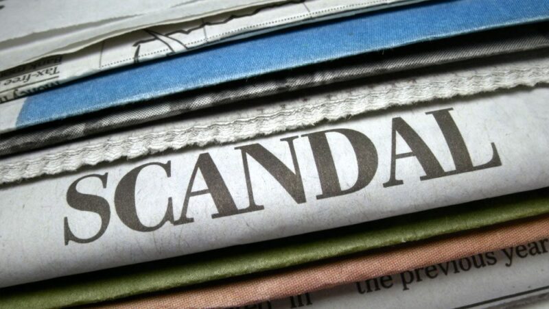 An image of a stack of newspapers, with one reading 