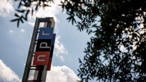 Photo of a sign reading NPR on a building at the National Public Radio headquarters in Washington, DC.