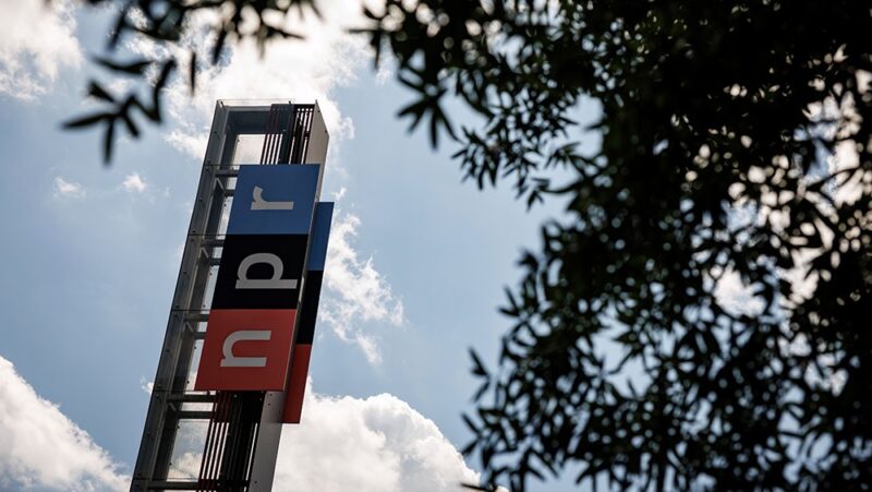 Photo of a sign reading NPR on a building at the National Public Radio headquarters in Washington, DC.