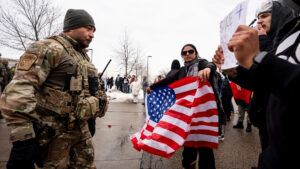 Federal agents and police clash with protesters outside the Bishop Henry Whipple Federal Building in Minneapolis, Minn. on Thursday, Jan. 8, 2026.
