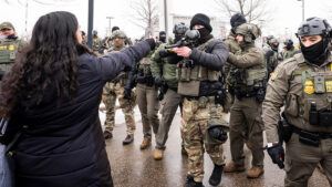 Photo shows a person recording officers