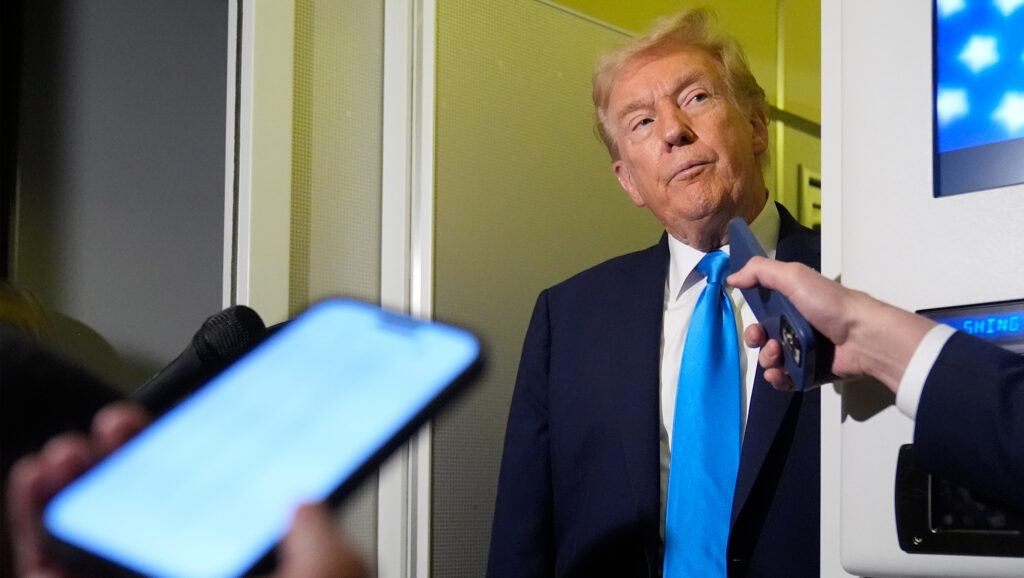 President Donald Trump listens to a question from a reporter aboard Air Force One at Al Udeid Air Base in Doha, Qatar, Saturday, Oct. 25, 2025.